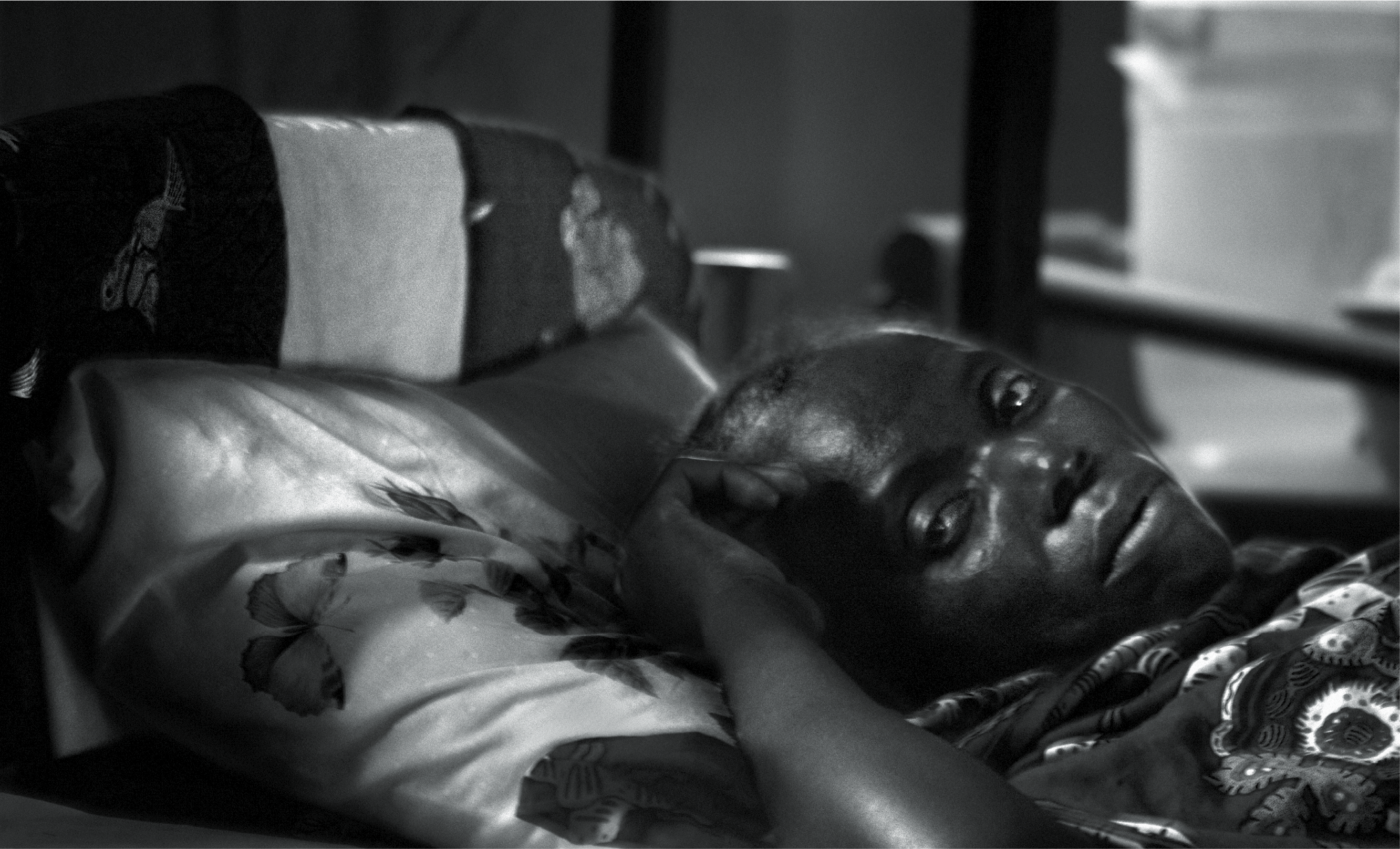 CENTRAL AFRICAN REPUBLIC - 2005: Pictured here, Bernadette survives thanks to generic antiretrovirals that cost �1 Euro per day. By 2006, medicines to fight her disease will be too expensive for her to continue fighting for her life. Testing and prevention against the sleeping sickness, human African trypanosomiasis, a parasitic disease caused by a protozoa, and transmitted by the tsetse fly. The majority of public hospitals suffer from structural problems, corruption and lack of economic resources. (Photo by Alvaro Ybarra Zavala/Edit by Getty Images)