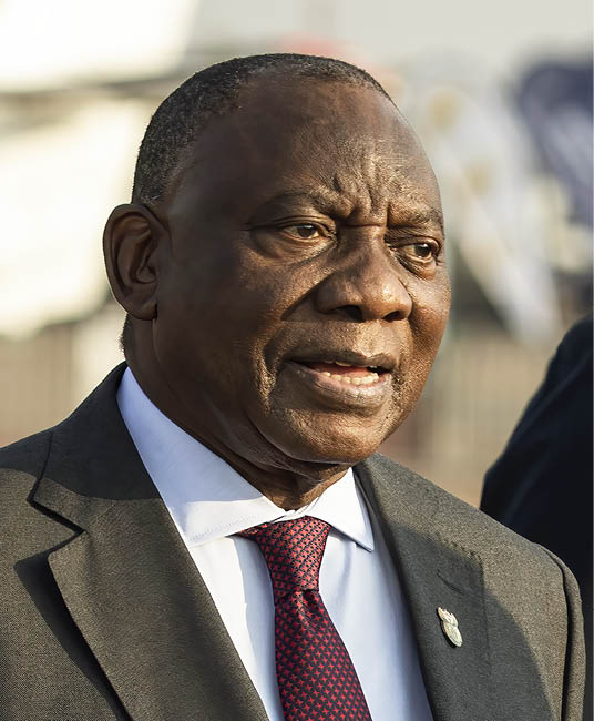 TSHWANE, SOUTH AFRICA - SEPTEMBER 18: South African President Cyril Ramaphosa walks among exhibitions at the Africa Aerospace and Defense (AAD) on September 18, 2024, in Tshwane, South Africa. The Africa Aerospace and Defense (AAD) combines a trade exhibition and an air show and is held biannually in Tshwane. President Ramaphosa spent hours walking around the fair and spoke to exhibitors from around the world. (Photo by Per-Anders Pettersson/Getty Images)