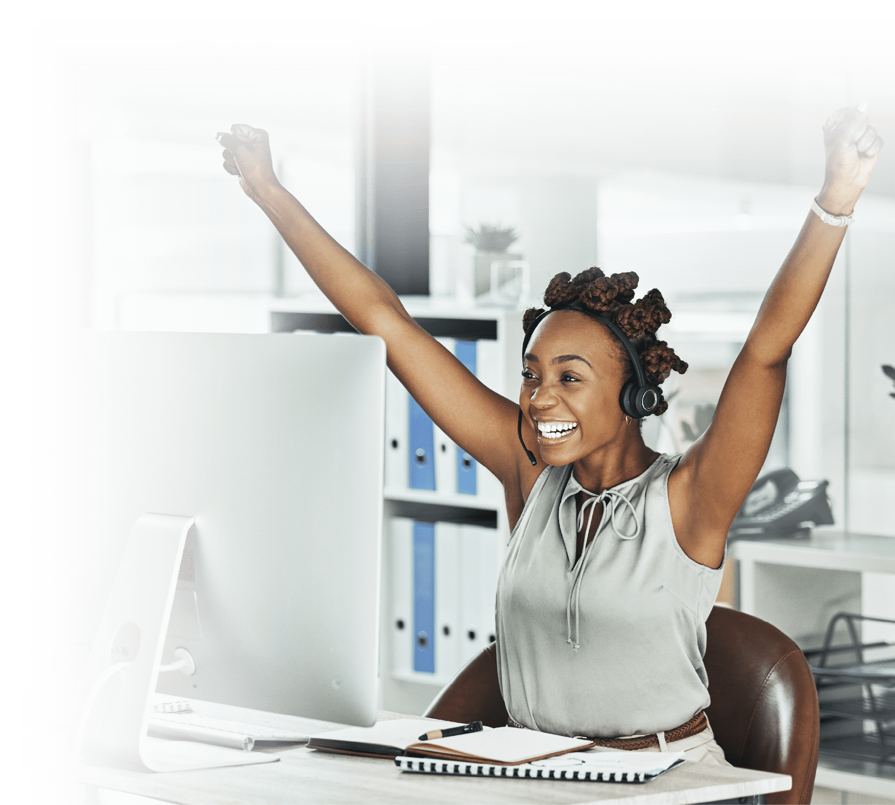 Call centre, cheerful and agent celebrating with arms up at her office desk. Successful, professional and positive customer review or bonus. Helpdesk worker excited with salary performance increase.