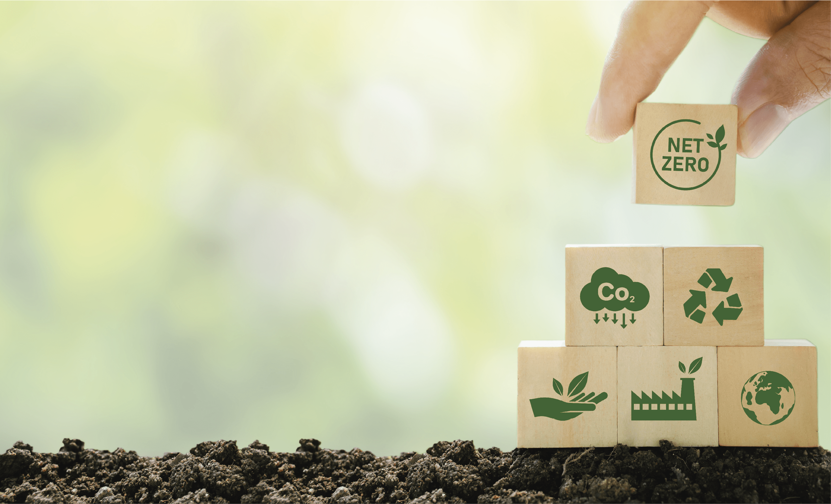 Net Zero and Carbon Neutral Concepts Net Zero Emissions Goals A climate-neutral long-term strategy Ready to put wooden blocks by hand with green net center icon and green icon on gray background.