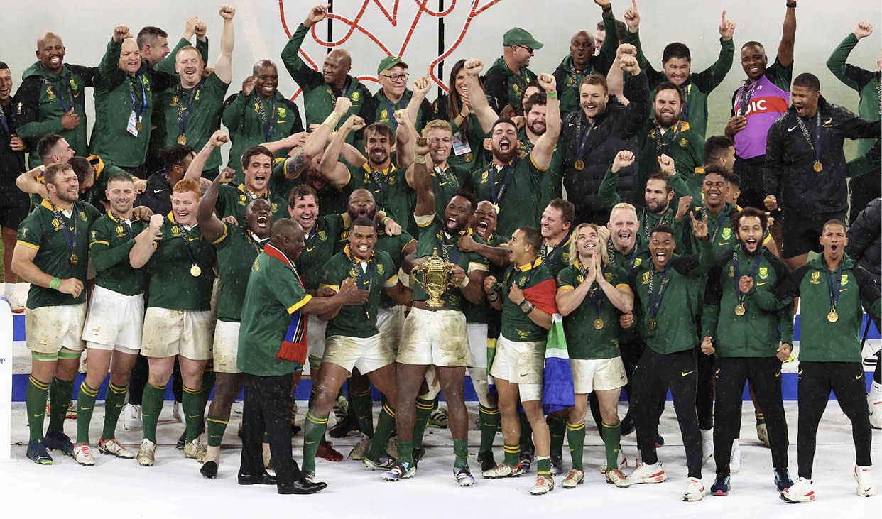 PARIS, FRANCE - OCTOBER 28: Captain, Siya Kolisi #6 of South Africa lifts the Webb Ellis Cup with teammattes following the Rugby World Cup France 2023 Gold Final match between New Zealand and South Africa at Stade de France on October 28, 2023 in Paris, France. (Photo by Xavier Laine/Getty Images)