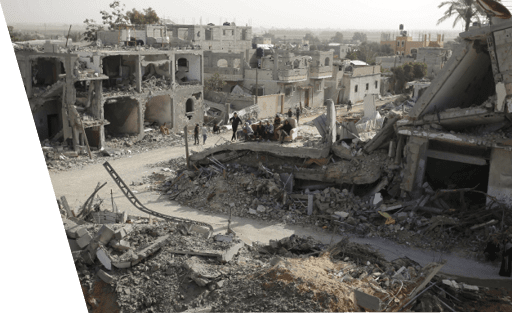 KHAN YUNIS, GAZA - NOVEMBER 26: Palestinians sit on a couch amid wreckage of the residential areas after Israeli attacks during third day of the humanitarian pause in Khan Yunis, Gaza on November 26, 2023. (Photo by Ashraf Amra/Anadolu via Getty Images)