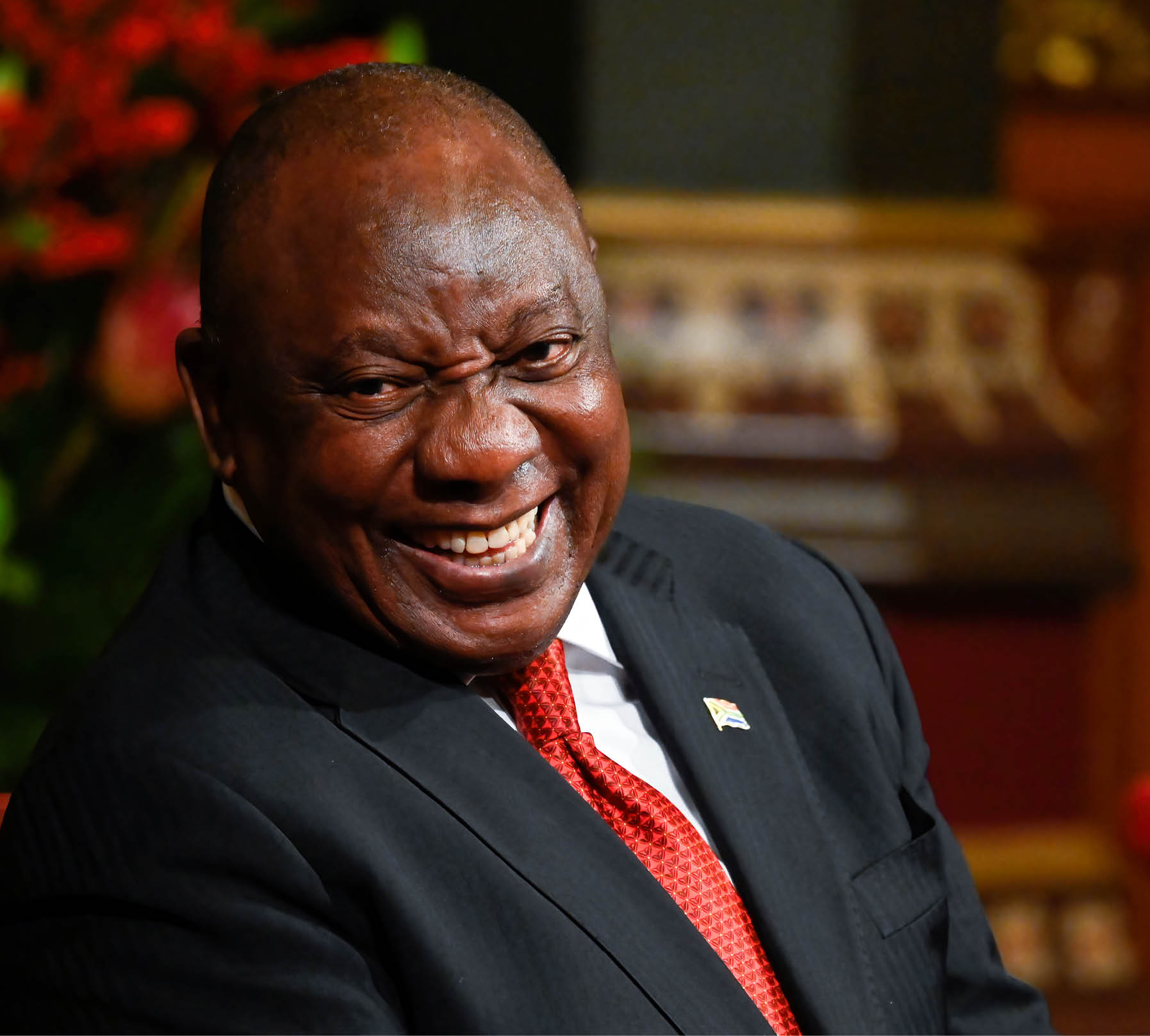 LONDON, ENGLAND - NOVEMBER 22: South African President Cyril Ramaphosa laughs as he visits the Houses of Parliament on November 22, 2022 in London, England. This is the first state visit hosted by the UK with King Charles III as monarch, and the first state visit here by a South African leader since 2010. (Photo by Toby Melville - WPA Pool/Getty Images)