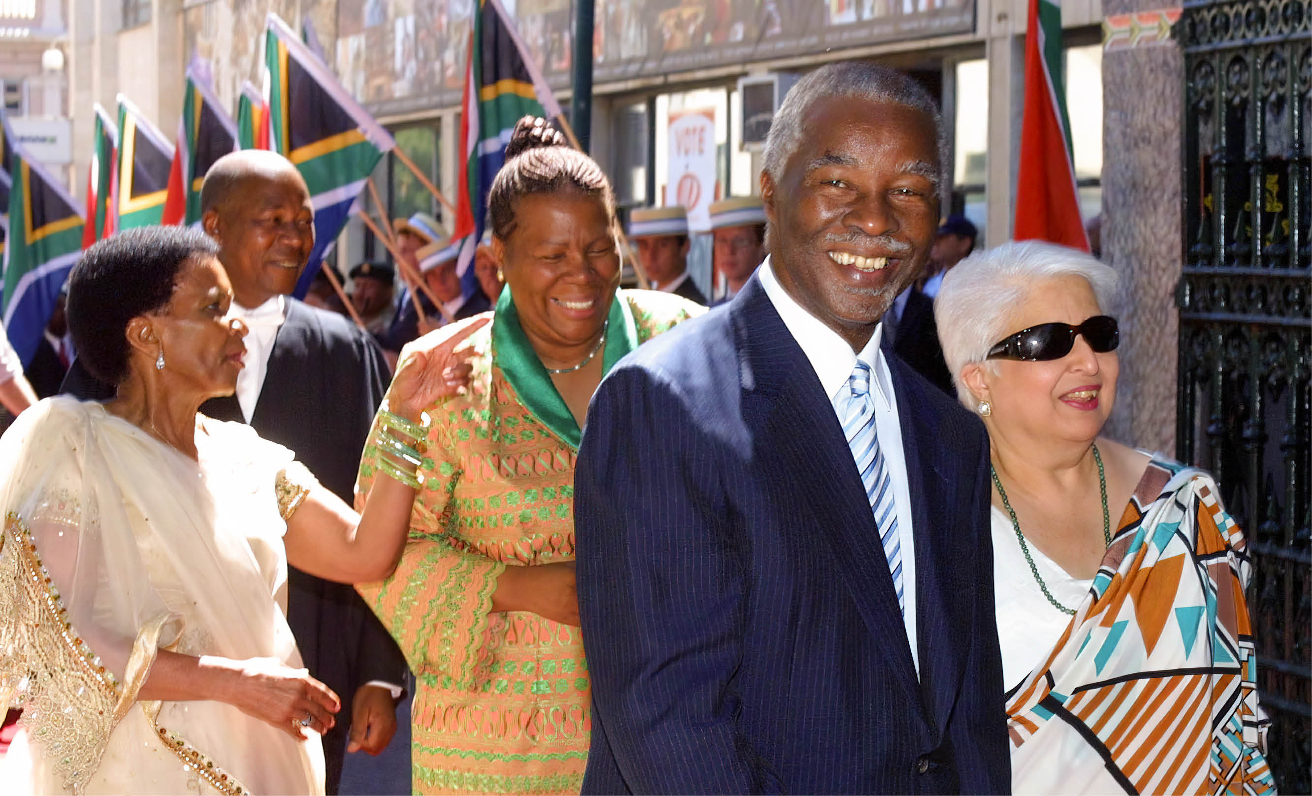 CAPE TOWN, SOUTH AFRICA: South African President Thabo Mbeki (2nd R), accompanied by speaker of the National Assembly Frene Ginwala (R) arrive for the official opening of parliament in Cape Town 06 February 2004.  President Thabo Mbeki will 09 February announce the date for South Africa's third elections since the end of apartheid, the speaker of parliament said on Friday. AFP PHOTO/ANNA ZIEMINSKI  (Photo credit should read ANNA ZIEMINSKI/AFP via Getty Images)