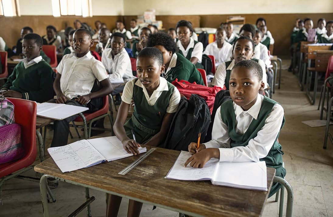 CWEBENI, SOUTH AFRICA FEBRUARY 2: Students listen to a teacher at Cwebeni Junior Secondary school on February 2, 2024, in Cwebeni, a rural village outside Port St Johns, South Africa. The village is one of the worst affected by poverty and hunger in the Eastern Cape Province, and in the entire country. The majority of the residents are unemployed and live off social grants, with most families struggling to feed their children with the social grants that only tend to last no more than half the month with the high cost of living. Many families are desperately trying to receive food parcels from different NGOs and sometimes from the government. A study has revealed about 27% stunting rate in the province and more children appear in hospitals undernourished, and there are an increasing number of children who die of malnutrition. About eight million children in South Africa live in food poverty, meaning they lack sufficient food to meet their basic nutritional needs. South African Human Rights Commission found that child hunger in the Eastern Cape qualifies as a disaster and should be declared as such. Many public schools in these areas provide a free meal and some even introduced a second meal per day, which helps the students concentrate on their studies as they often arrive hungry to school, due to lack of sufficient food in their homes. (Photo by Per-Anders Pettersson/Getty Images)