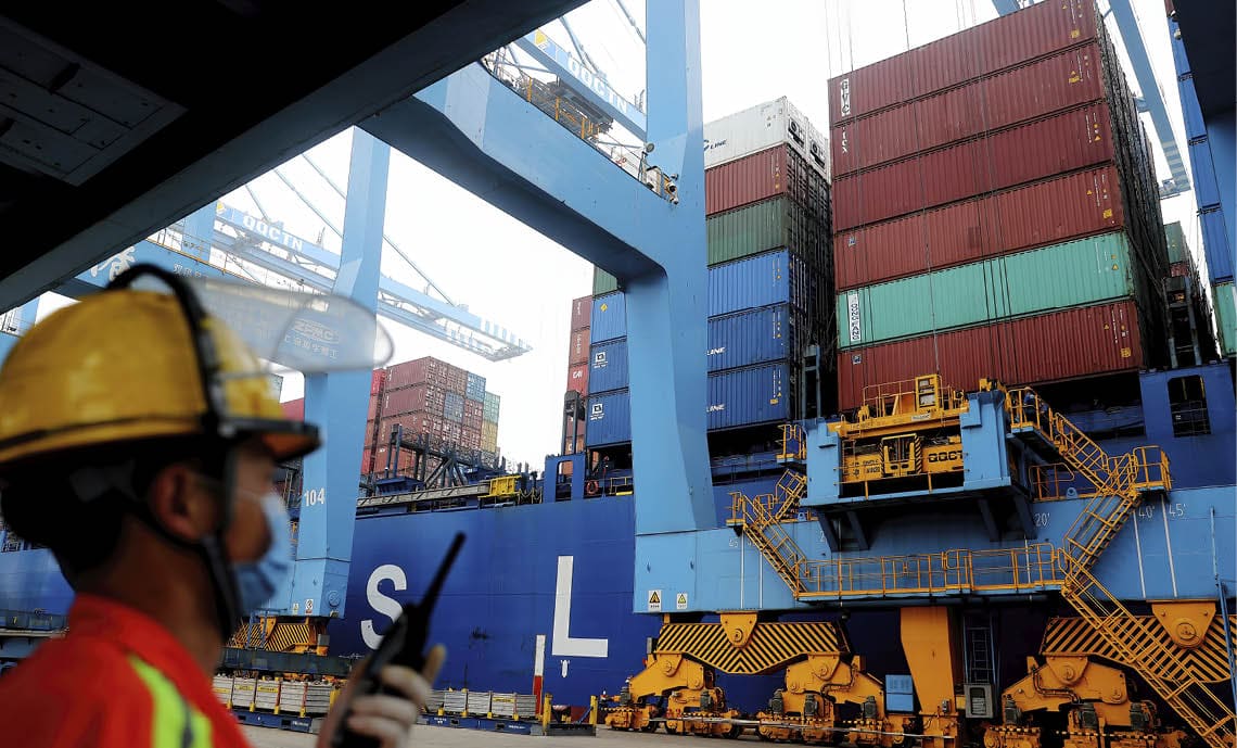 QINGDAO, CHINA - JUNE 22, 2022 - A freighter loads goods for export to South Africa in Qingdao, Shandong Pilot Free Trade Zone, June 22, 2022. According to Qingdao Customs statistics, in the first five months, Shandong's import and export to BRICS countries reached 152.47 billion yuan, up 5.2% year on year. Exports totaled 59.06 billion yuan, up 36.3%. (Photo credit should read CFOTO/Future Publishing via Getty Images)