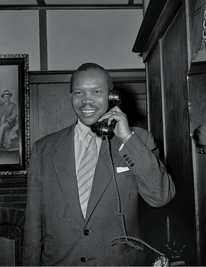 Botswanan politician Seretse Khama (1921 - 1980) speaking on the telephone, October 1st 1956. After denouncing the tribal throne, Khama has been allowed to return to Bechuanaland as a private citizen. (Photo by Evening Standard/Hulton Archive/Getty Images)