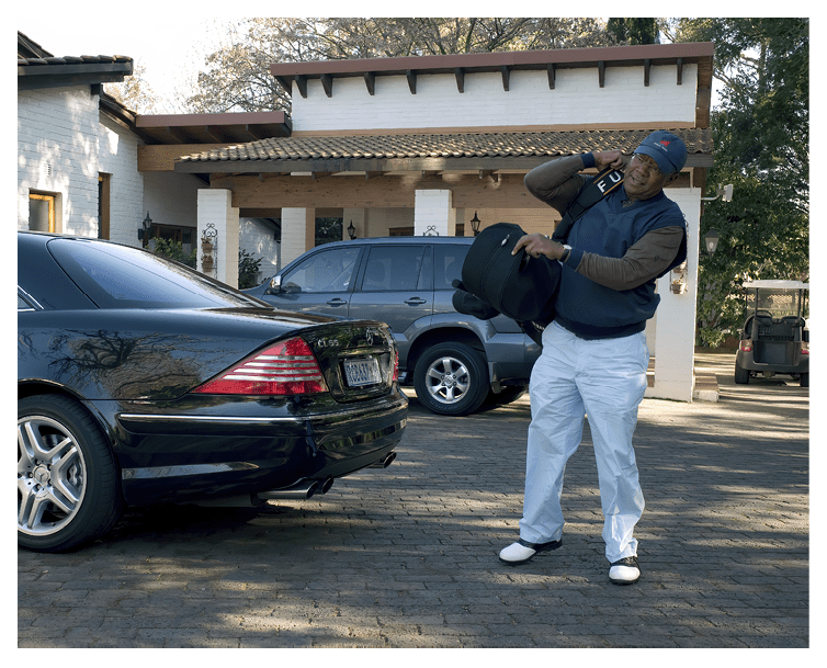 JOHANNESBURG, SOUTH AFRICA - JULY 9: Peter Vundla, a businessman, leaves his CL55 Mercedes to practice golf on July 9, 2008 at River Club, a member only exclusive golf club in Bryanstown, South Africa. Mr. Vundla started out in advertising with some black colleagues in 1991, before democracy came to the country in 1994. He later sold the successful agency HerdBoys to McCann Erickson. It made him rich and he later bought stakes in companies that were looking for empowerment partners. He loves golf, cars (he drives an Aston Martin, and a few top Mercedes) and collects art and he is a board member of several companies. He belongs to a small black elite who has prospered incredibly in the new South Africa.  (Photo by Per-Anders Pettersson/Getty Images)
