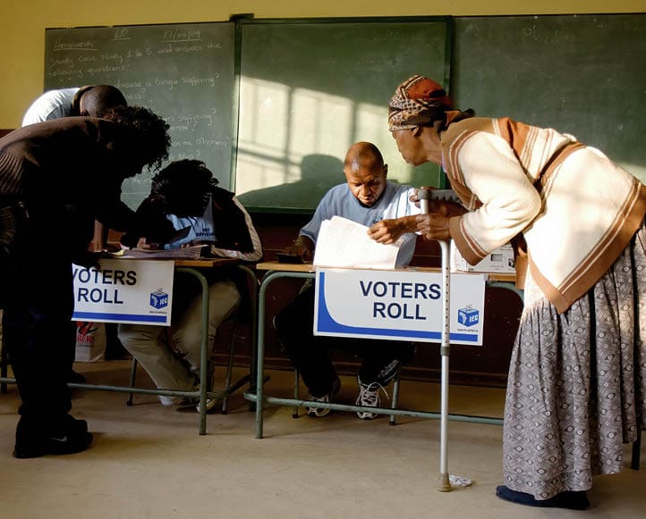 LIMPOPO, SOUTH AFRICA - APRIL 22: (BRAZIL OUT, UAE OUT & SOUTH AFRICA OUT) Mokgadi Leokana (R) waits to cast her vote at the Tlaou Kwena Primary School on April 22, 2009 in Moutse, Limpopo. The ruling African National Congress was favored to win the majority of seats in the national assembly during Wednesday's vote, although rival parties are expected to make their best showing since the ANC took power in 1994.  (Photo by Foto24/Gallo Images/Getty Images)