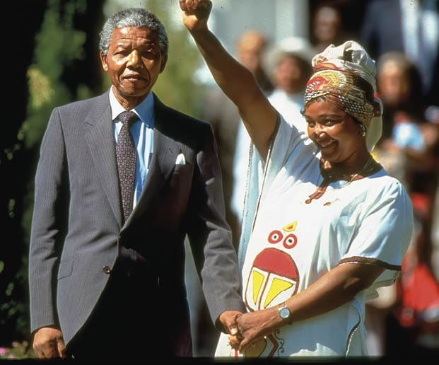S. African ANC ldr. Nelson Mandela standing w. wife Winnie.   (Photo by Allan Tannenbaum/Getty Images)