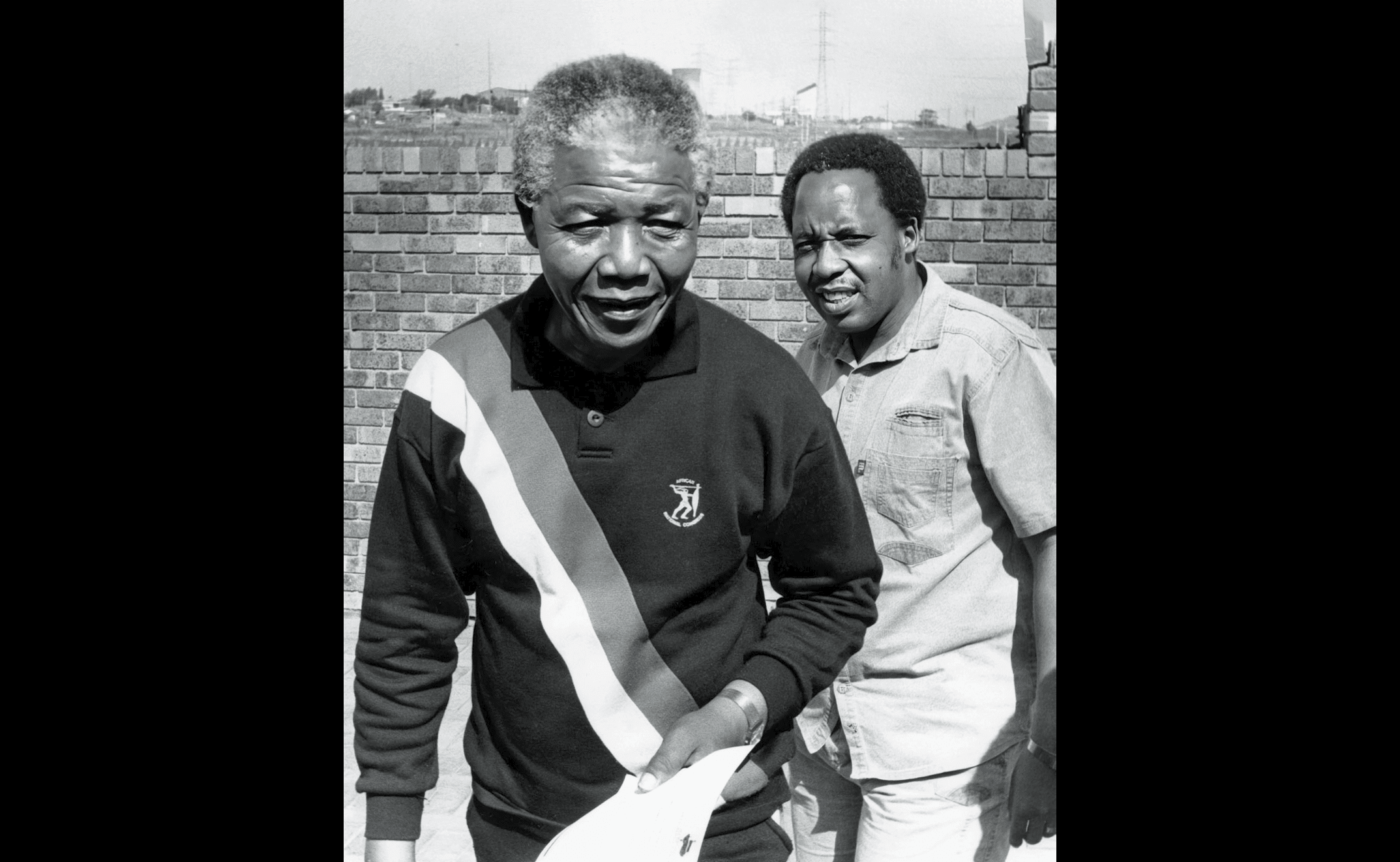SOUTH AFRICA - 30 September 1990 (SOUTH AFRICA OUT): ANC deputy president Nelson Mandela leads Umkhonto we Sizwe chief of staff Chris Hani to face the media at the Mandela home in Orlando West yesterday. Hani said MK would continue to recruit cadres. (Photo by Linden Birns/Business Day/Gallo Images/Getty Images)