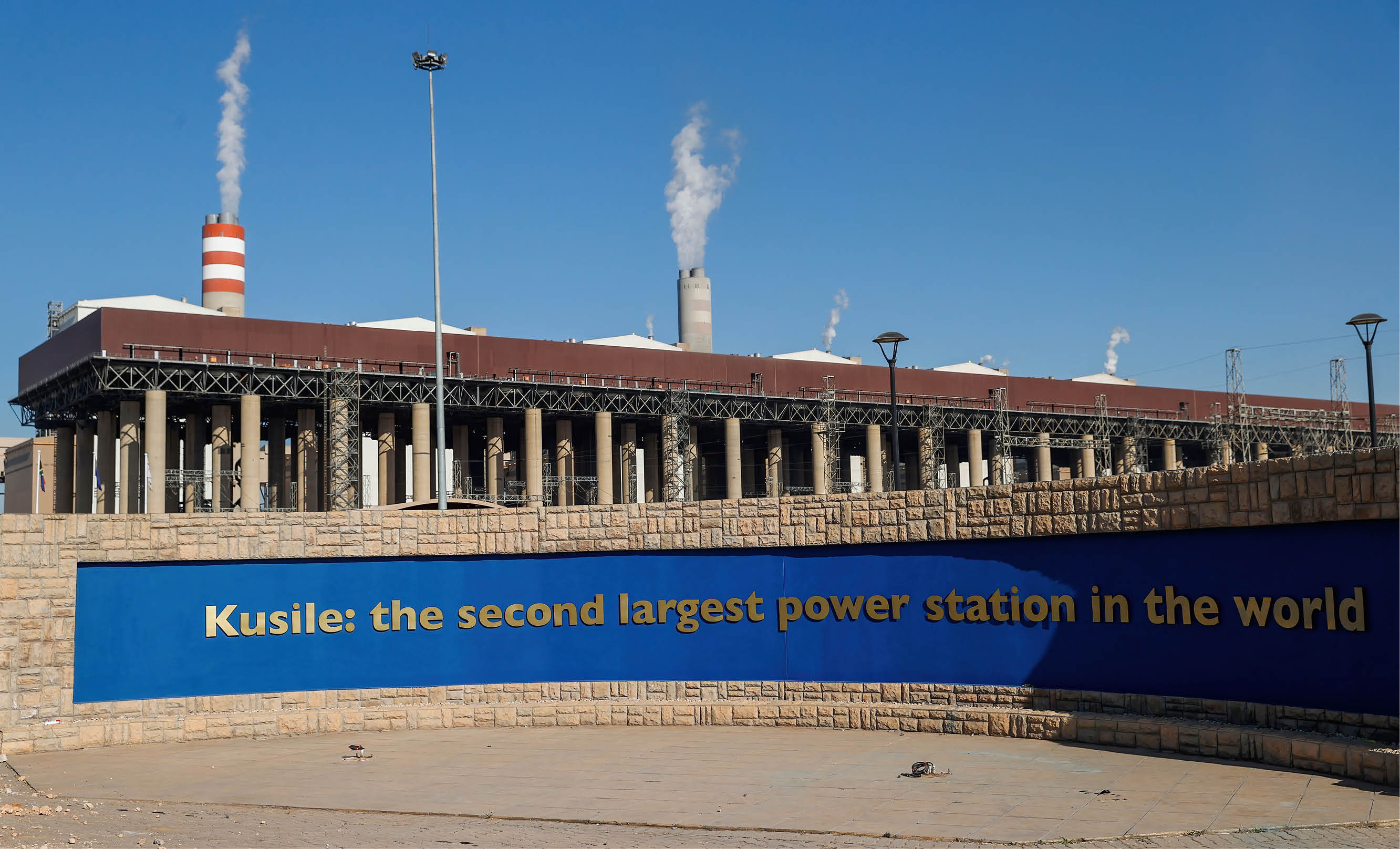 A general view of the Kusile Power Station, a coal-fired power plant located on the Hartbeesfontein Farm in eMalahleni on June 8, 2022. - The power stations construction is sponsored by state electricity utility Eskom and is the fourth-largest coal plant in the world. The project started in 2008 and encountered multiple delays including allegations of corruption, design defects and massive cost overruns. (Photo by Phill Magakoe / AFP) (Photo by PHILL MAGAKOE/AFP via Getty Images)