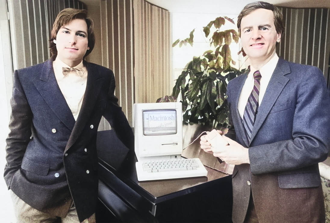 16th January 1984: American businessman Steve Jobs (L), Chairman of Apple Computers, and John Sculley, Apple's president, pose with the new Macintosh personal computer, New York City.  (Photo by Marilyn K. Yee/New York Times Co./Getty Images)
