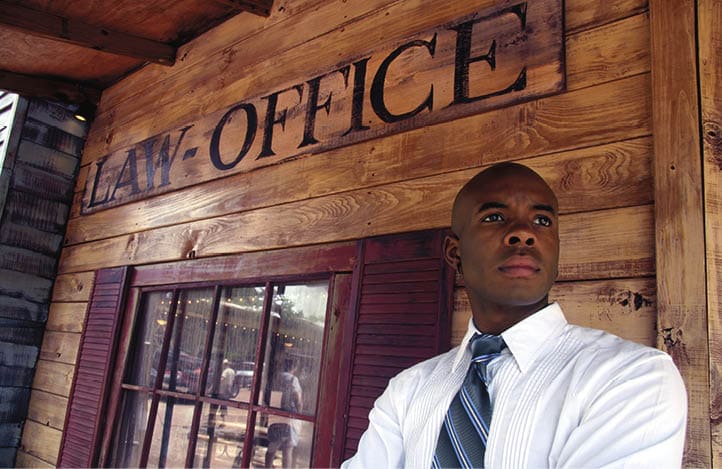 A lawyer outside his law office.