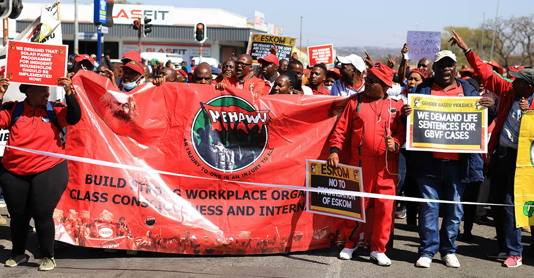 POLOKWANE, SOUTH AFRICA - AUGUST 24: Protesters march to the Premier's office during the national shutdown march on August 24, 2022 in Polokwane, South Africa. The Congress of South African Trade Unions (COSATU) issued a call to all workers and South Africans to join its national strike to address the rising living costs, unemployment, crime, load shedding and rising fuel prices. (Photo by Philip Maeta/Gallo Images via Getty Images)