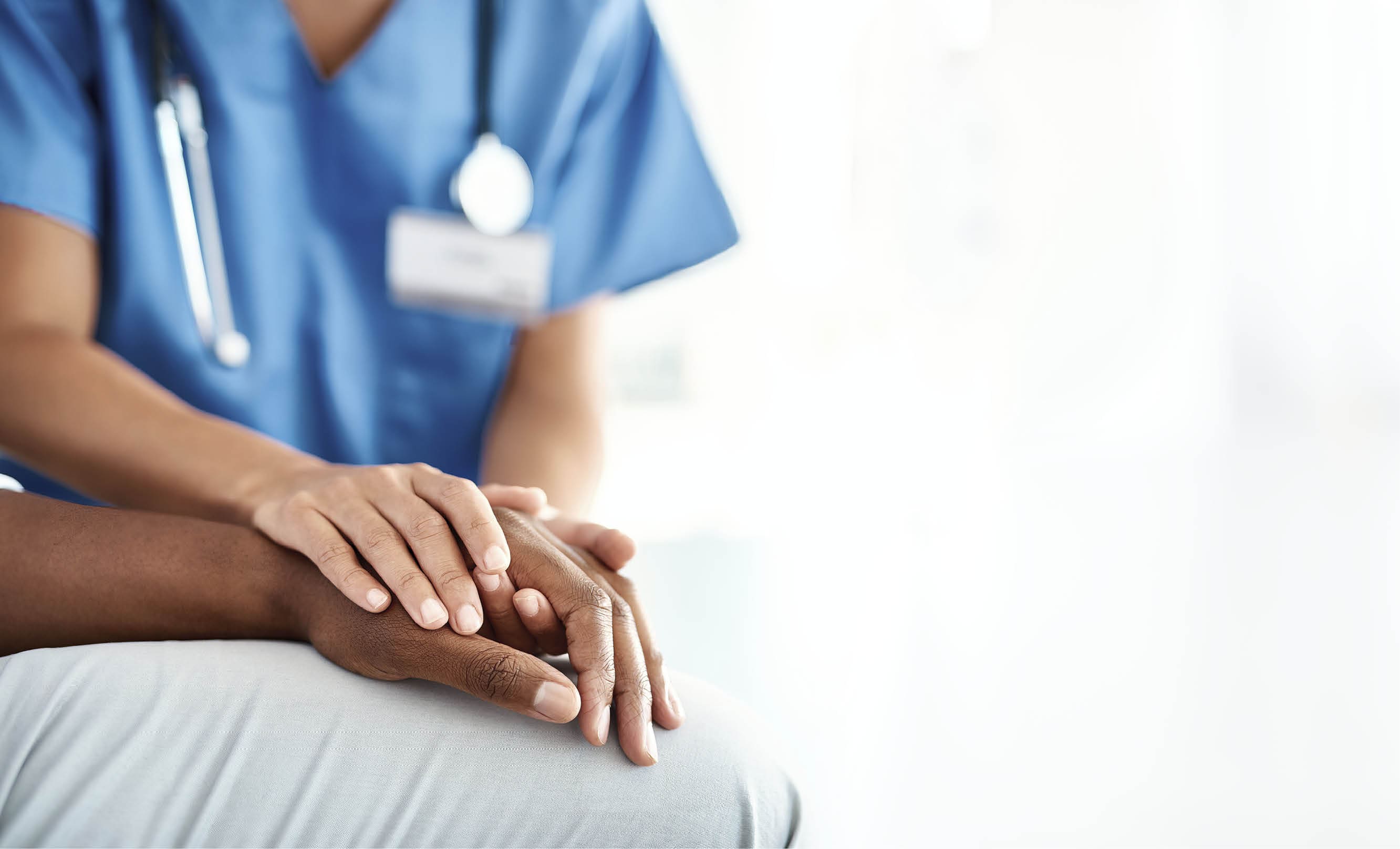 Cropped shot of an unrecognizable female nurse comforting a patient in the hospital