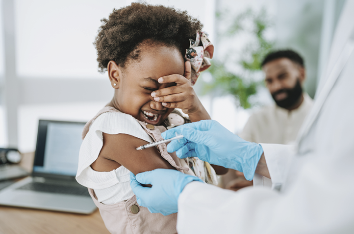 Scared and crying child being vaccinated