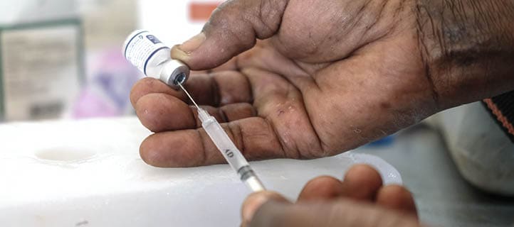 APAC DISTRICT, UGANDA - APRIL 8: A nurse prepares a syringe by drawing a dose of malaria vaccine at Apac General Hospital on April 8, 2025 in Apac District, Uganda. Uganda's Ministry of Health has begun the rollout of a massive malaria vaccine campaign that is expected to prevent at least 800 severe cases of malaria among children daily, with an initial target of vaccinating 1.1 million children under the age of two in the most affected districts of the East African nation. The R21/Matrix-M malaria vaccine is administered over four doses at 6, 7, 8, and 18 months and will be integrated into routine immunizations for young children, for whom the mosquito-transmitted disease is the leading cause of illness and death in Uganda. (Photo by Hajarah Nalwadda/Getty Images)
