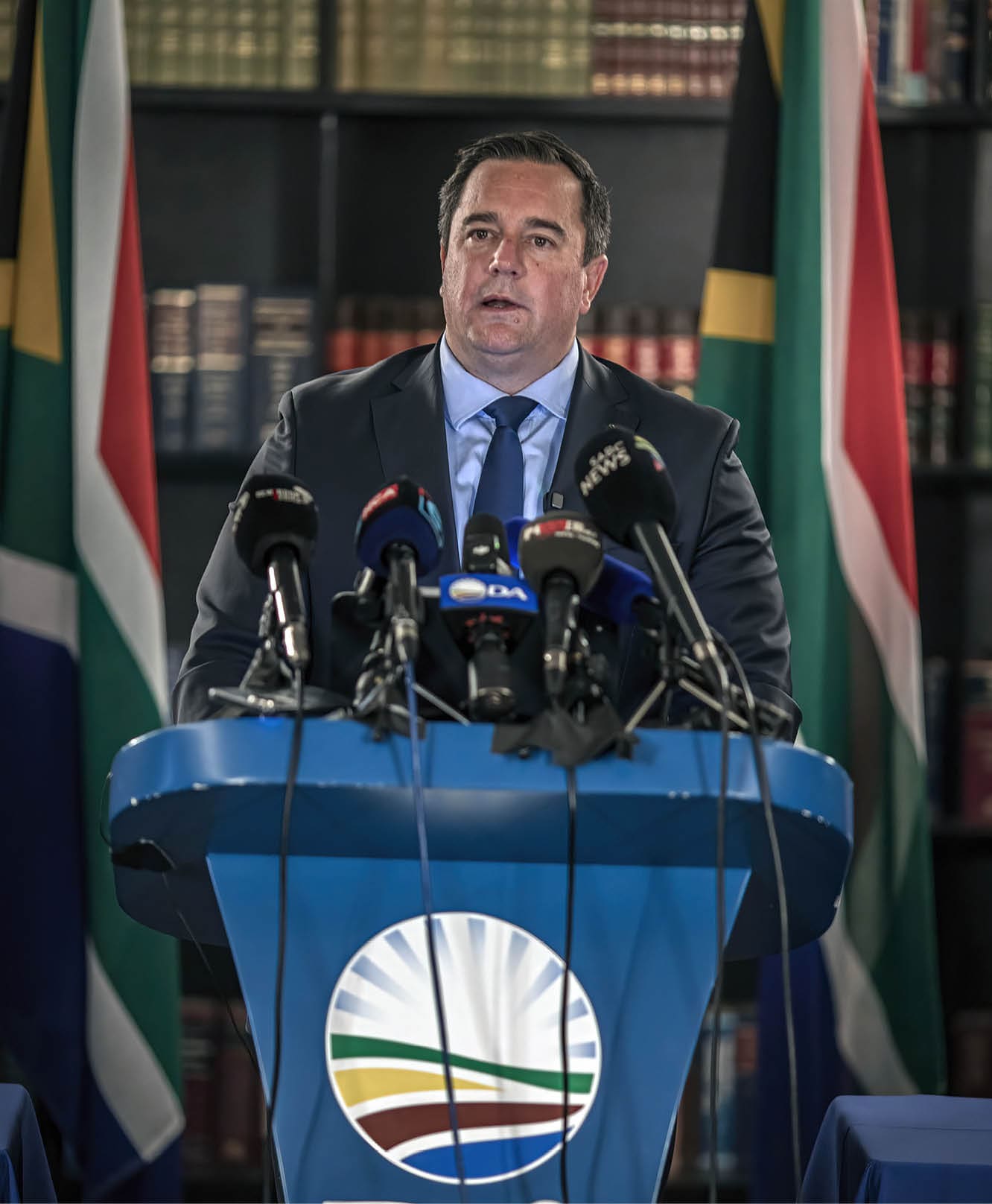 CAPE TOWN, SOUTH AFRICA - JUNE 28: Democratic Alliance (DA) Party leader John Steenhuisen speaks at a press briefing on June 28, 2025 at 15 On Orange Hotel in Cape Town, South Africa. Earlier this week, President Cyril Ramaphosa dismissed Democratic Alliance member Andrew Whitfield from his role as Deputy Minister of Trade and Industry over an unauthorised trip to the United States, escalating tensions within South Africa's coalition government. (Photo by Per-Anders Pettersson/Getty Images)