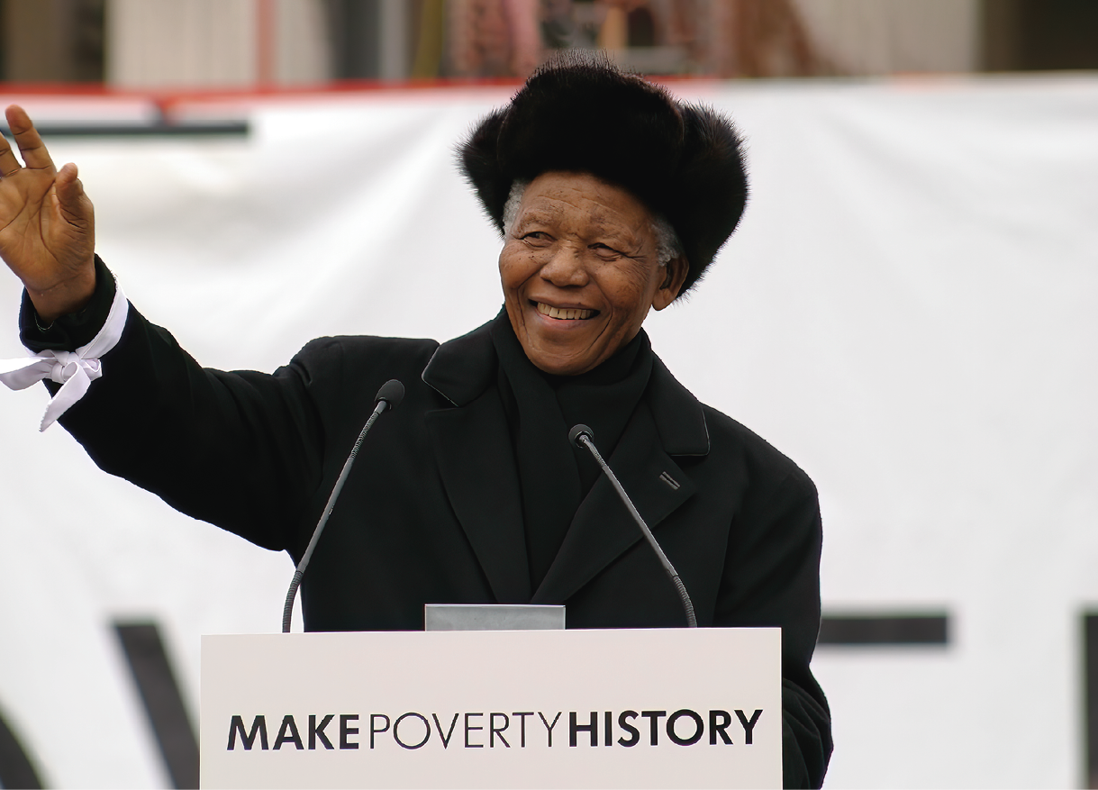 Nelson Mandela addresses over 22,000 people in Trafalgar Square on behalf of the MAKEPOVERTYHISTORY coalition. He hands a group of school children his white band to be delivered with thousands of others to the leaders of the G8. 
