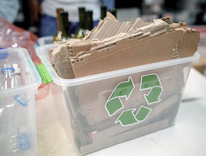 Recyclable material in different containers at a waste management centre - Environmental conservation concepts