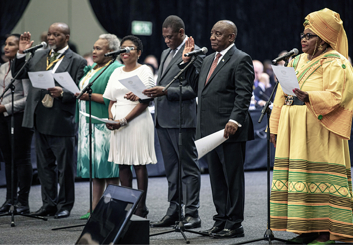 CAPE TOWN, SOUTH AFRICA - JUNE 14: President Cyril Ramaphosa (2nd R) and fellow ANC members are sworn in at the 7th sitting of the South African Parliament on June 14, 2024, at the Cape Town Convention Center in Cape Town, South Africa. The 400 members of the National Assembly was sworn in and the ceremony was presided by Chief Justice Raymond Zondo. (Photo by Per-Anders Pettersson/Getty Images)