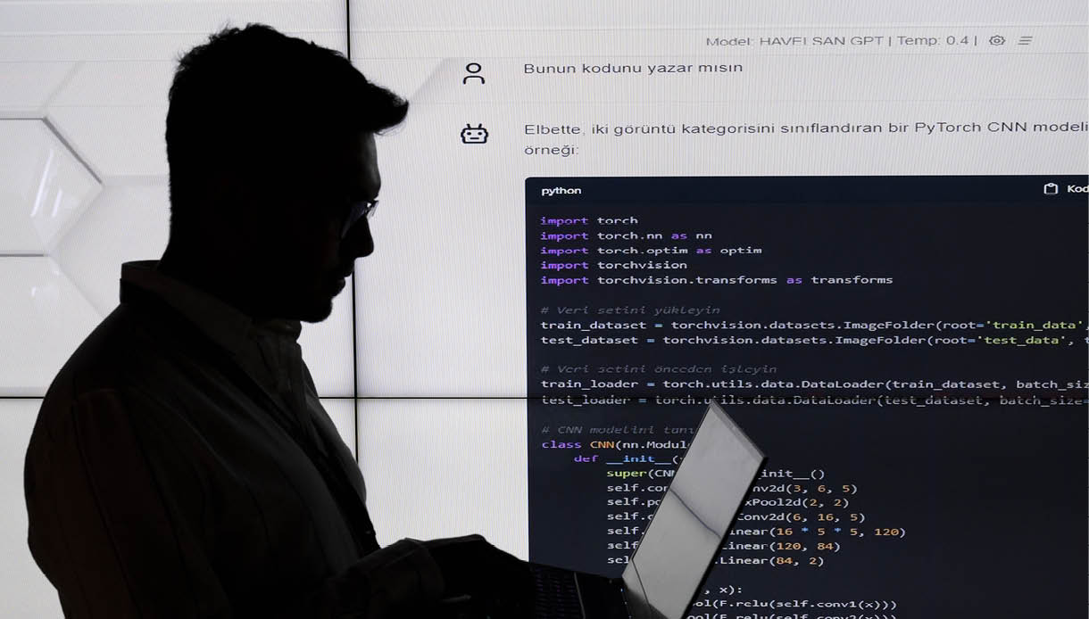 ANKARA, TURKIYE - DECEMBER 22: A person is seen in front of a code written by 'HAVELSAN GPT' was produced within the scope of artificial intelligence studies by HAVELSAN, which draws attention with its software-based solutions in the defense industry in Ankara, Turkiye on December 22, 2023. Turkish engineers have developed a national solution to artificial intelligence models in the field of natural language processing, which has recently become popular all over the world. (Photo by Utku Ucrak/Anadolu via Getty Images)